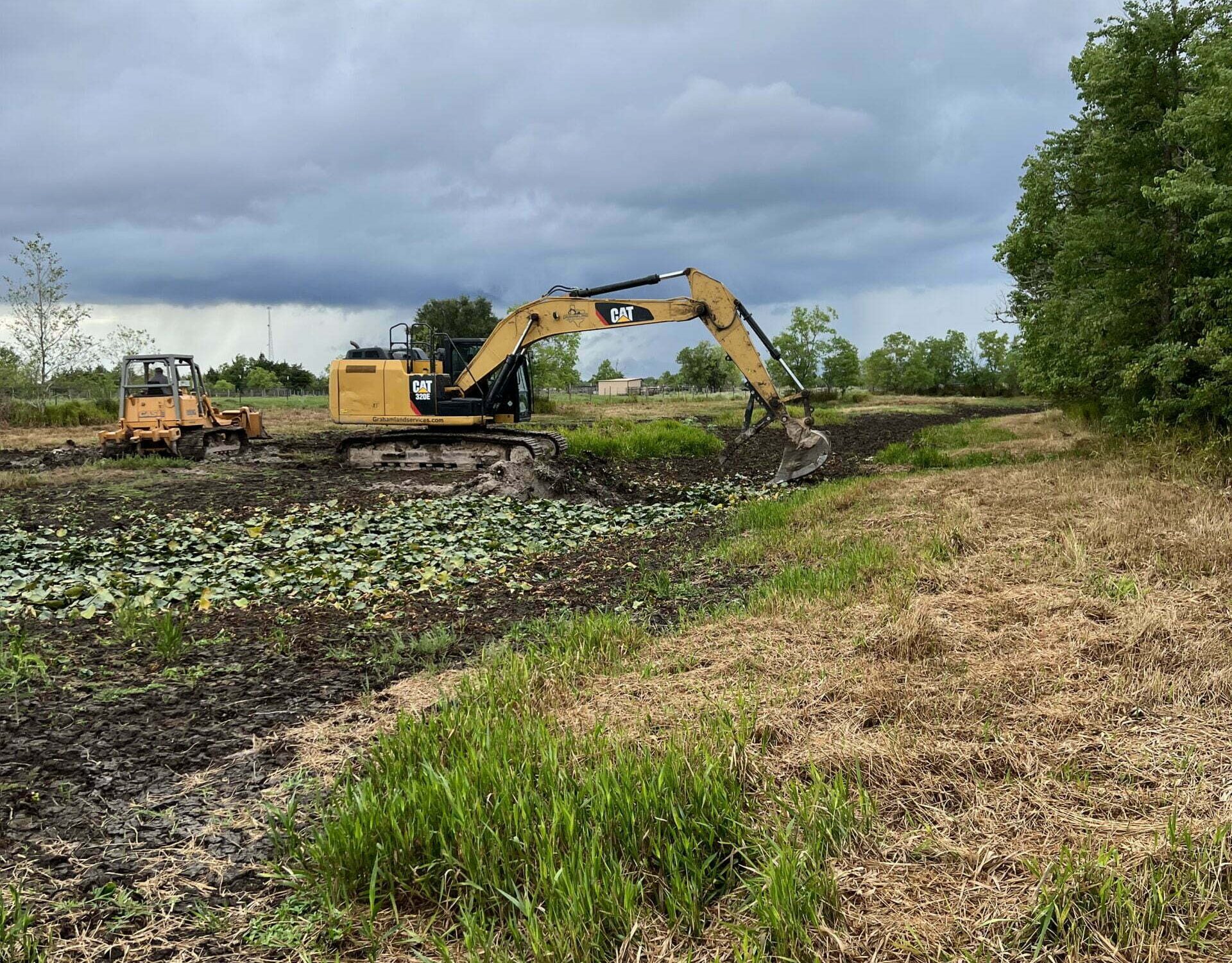 CAT performing land clearing